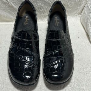 Black patent leather Clark’s dress loafers